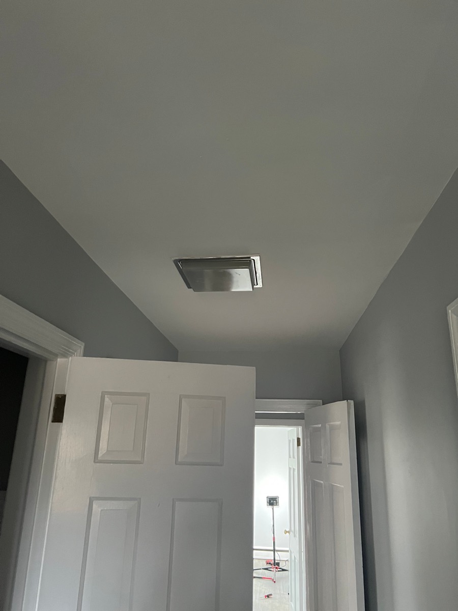 Hallway ceiling after repair — smooth finished ceiling