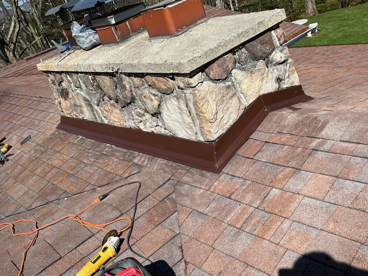 Chimney after repair — stone chimney with crisp new counterflashing