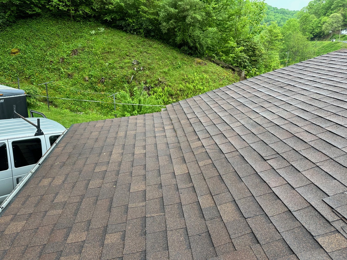 Roof after repair — clean finished architectural shingle field